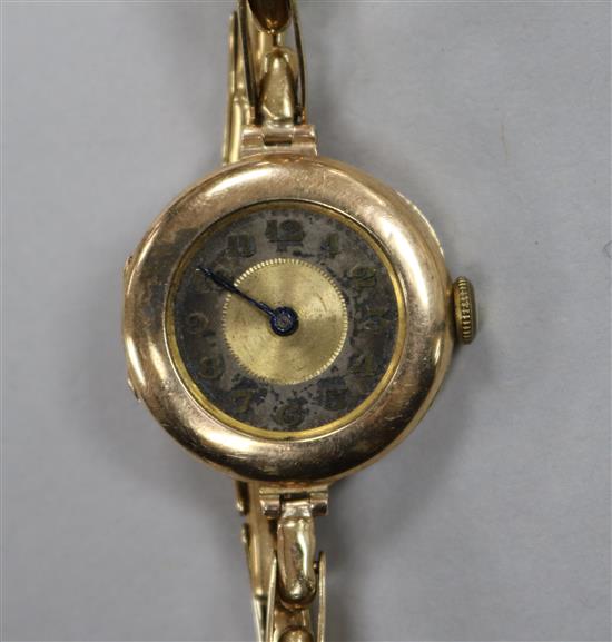 A ladys early 20th century 9ct gold Lanco wrist watch, on a 9ct gold flexible strap.